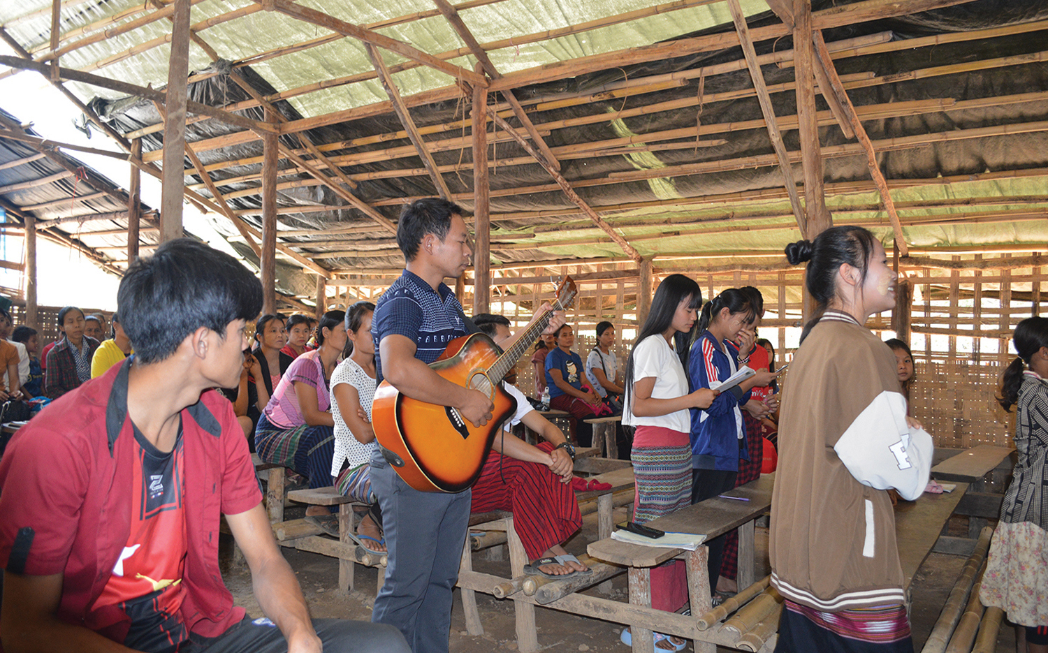 Htay Ree leads worship at the Baptist church.
