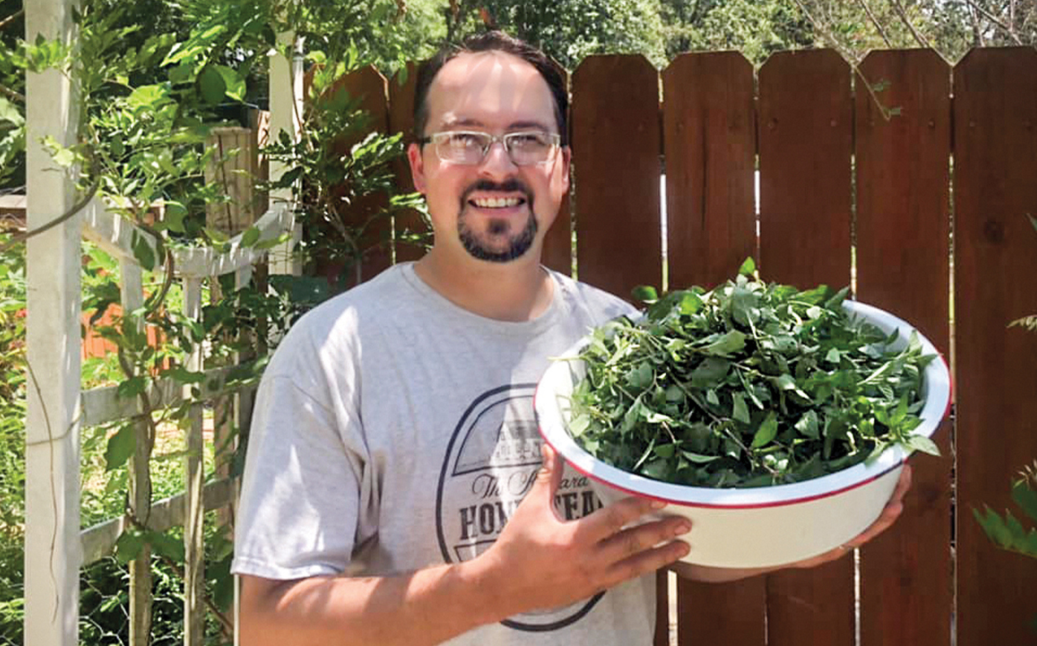Pastor Tim Kinnard with herbs from the family garden.